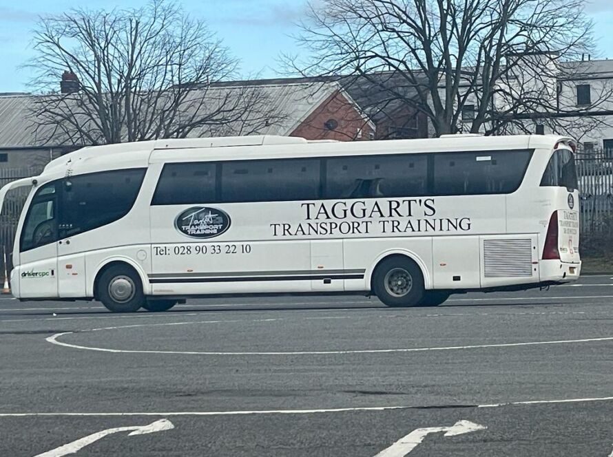 Taggart Transport Training branded bus parked in a lot